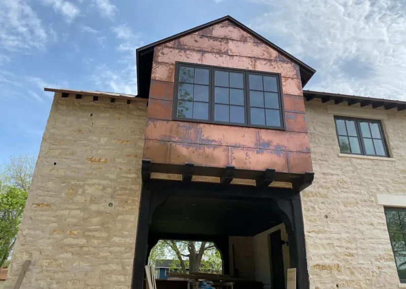 Copper metal panel facade on a stone building for Skylight Installation in Thousand Oaks