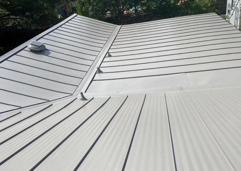 Solar attic fan installed on a metal roof for Roof Ventilation in Thousand Oaks